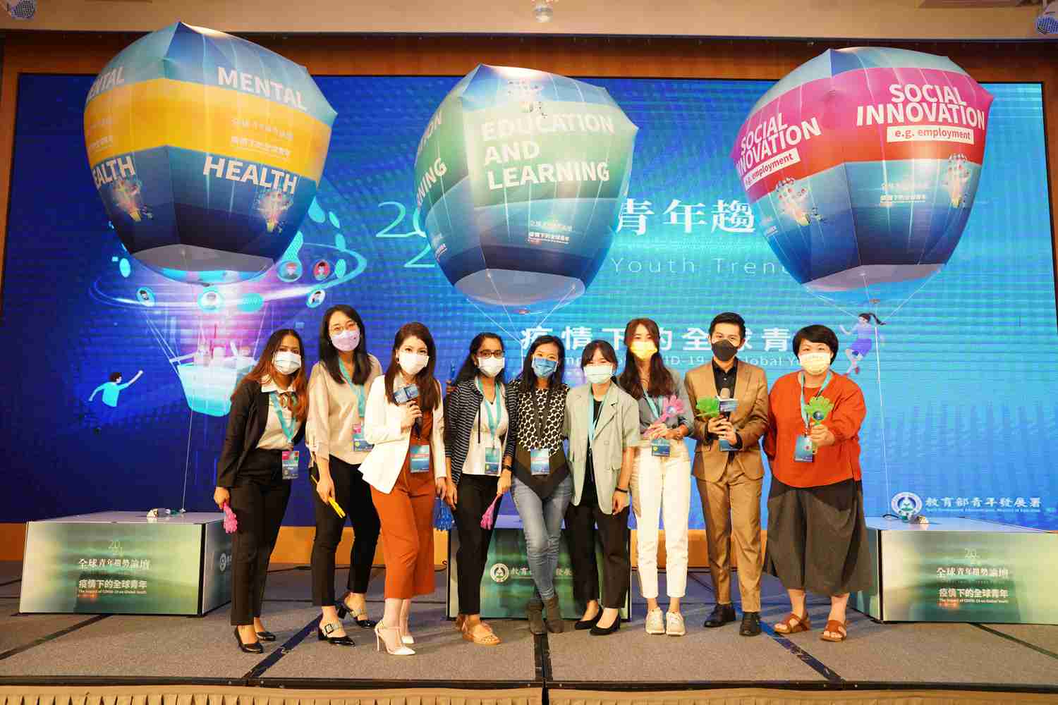 Group Photo in Front of Event Board